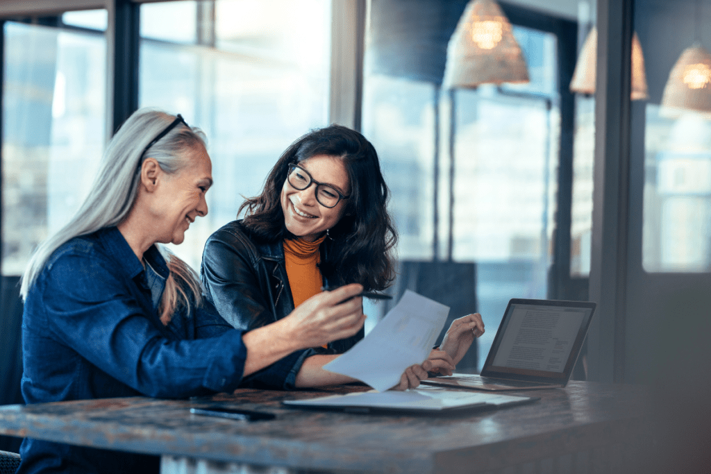 women working together laughing